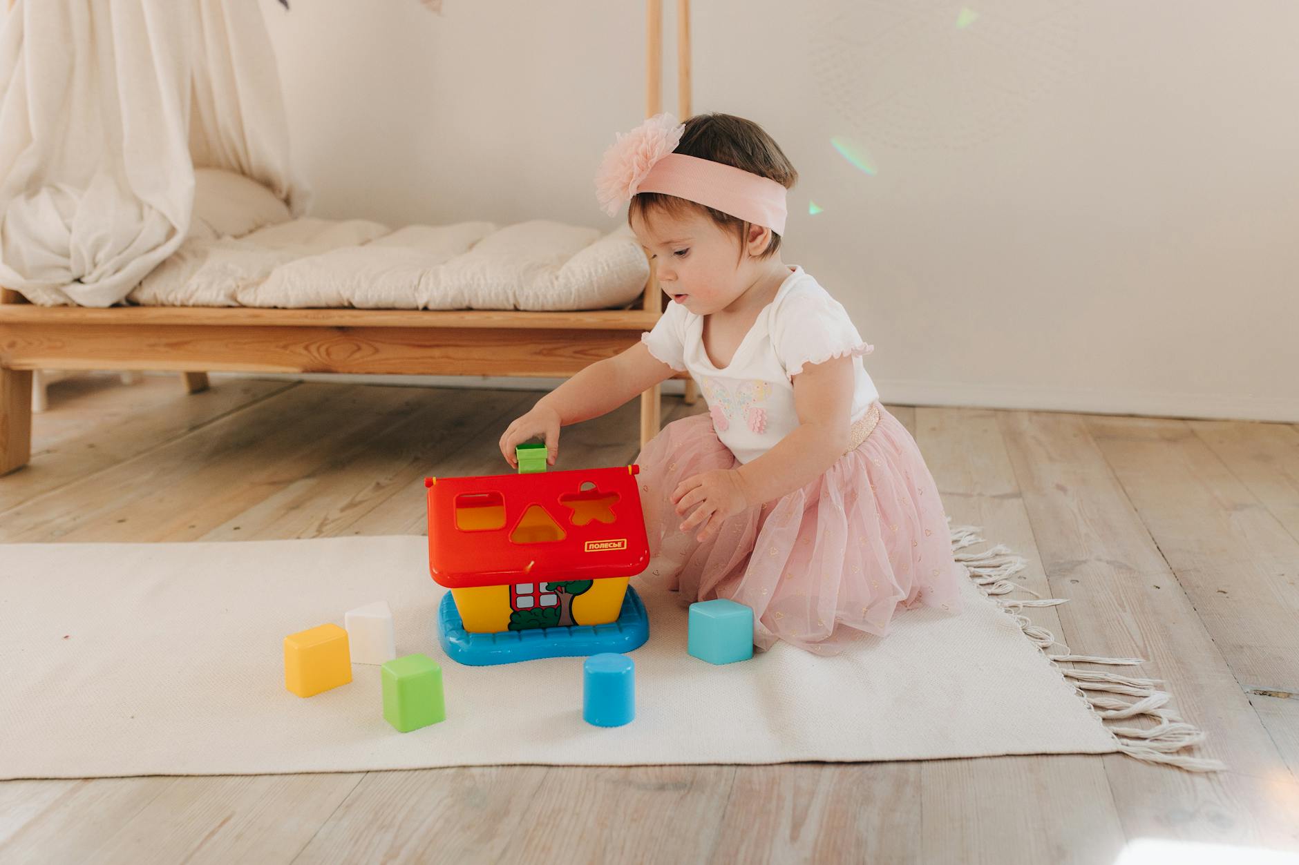 Image child with bed in background . Credit Image Polesie |Toys